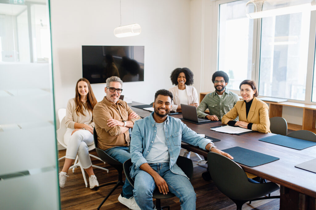 Business team examining retirement plan reports and conducting a 401(k) fee benchmarking review to assess provider fees and ensure plan cost efficiency.